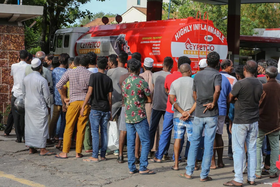 Peoples wait to get fuel from a gas station amid a fuel shortage in Colombo, Sri Lanka, 18 June 2022. Sri Lanka is bankrupt and the acute pain of its unprecedented economic crisis will linger until at least the end of next year, Prime Minister Ranil Wickremesinghe told parliament on Tuesday (July 5).