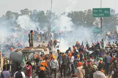 Police used tear gas and barricades to stop thousands of farmers from marching to New Delhi to press their demands that the government set a minimum price for all their produce to ensure they can sustain their livelihood.