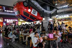 Diners at a shopping mall in Beijing on Aug 12.  China's hoped-for rebound has fizzled out, with the economy tumbling into deflation.