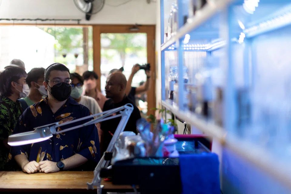 Customers queue up to buy cannabis at the Highland Cafe on the first day of removing it from the narcotics list under Thai law in Bangkok, Thailand.