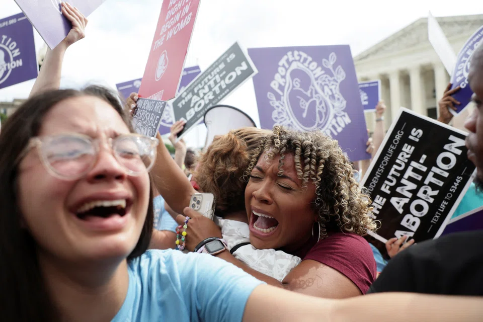 Anti-abortion demonstrators celebrate outside the United States Supreme Court as the court rules in the Dobbs v Women’s Health Organization abortion case, overturning the landmark Roe v Wade abortion decision in Washington on June 24, 2022. 