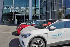 Cars are parked in front of the entrance to Volkswagen's production site building in Dresden; the Ifo institute's September business climate index stands at 85.7, a decline from a revised 85.8 in August.