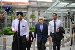 S Iswaran (centre), 61, was arrested by CPIB on Jul 11, 2023, following its investigation into a separate matter. He was then released on bail.