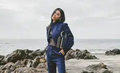 Mae Tan in a chiffon top, jacket, trousers, leather slip on heel and a Peekaboo bag, all from Fendi. 
