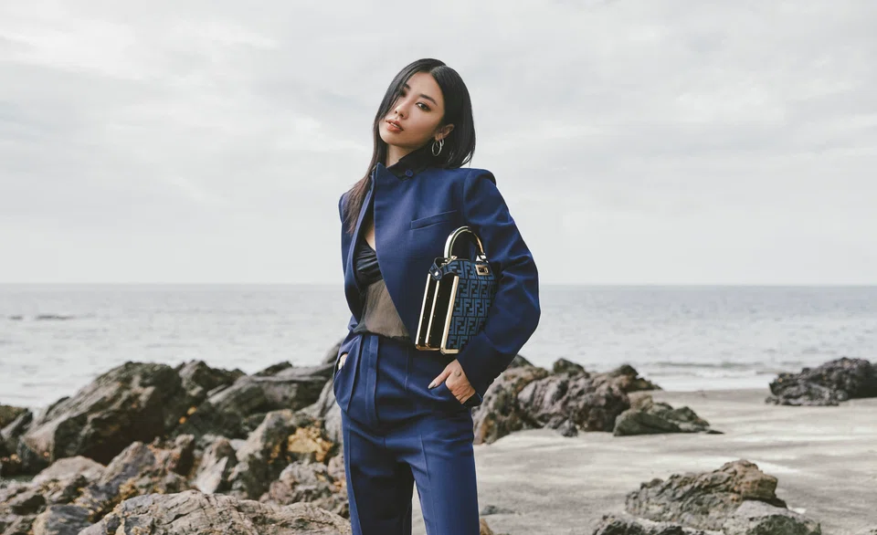 Mae Tan in a chiffon top, jacket, trousers, leather slip on heel and a Peekaboo bag, all from Fendi. 