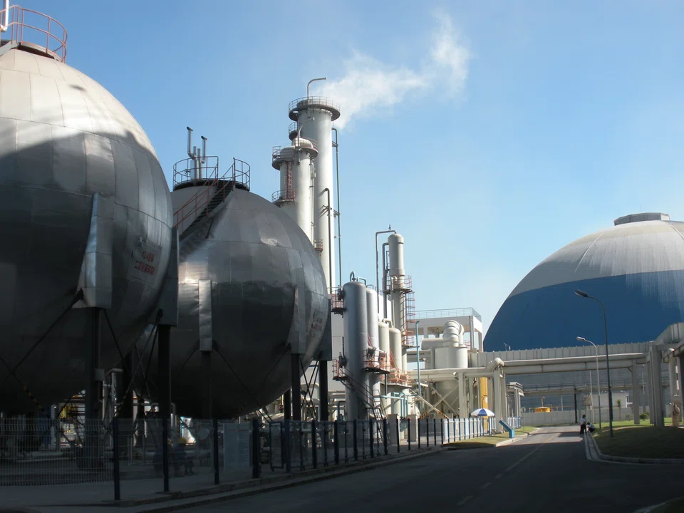 The carbon dioxide generated from operating this coal-fired plant in Shanghai's Shidongkou Second Power Plant is 
collected and stored in liquefied form in these 2 giant sphere-shaped storage tanks, part of the carbon capture facility at the plant. The Keppel-NEA tie-up will look into a similar carbon-capture facility for waste-to-energy plants in Singapore. 