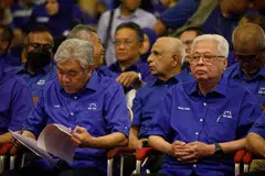UMNO president Ahmad Zahid Hamidi (left) left out eight ministers and deputy ministers from the candidate list of the Barisan Nasional coalition that the party leads. 