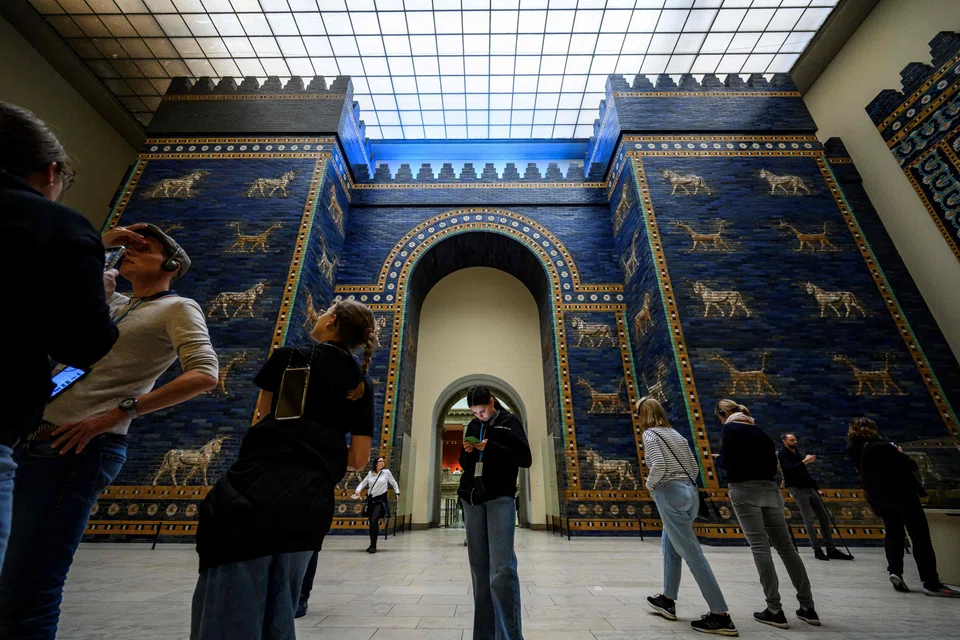 Visitors crowd the Ishtar Gate, constructed around 575 BC by King Nebuchadnezzar II, in the south wing of The Pergamon Museum. 