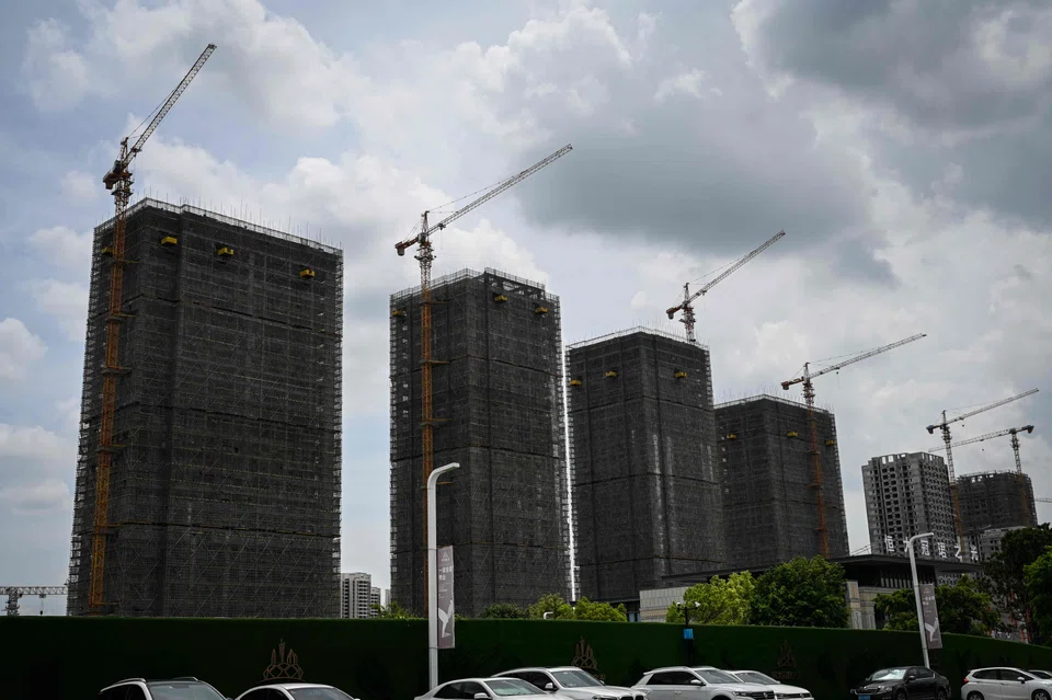 A general view shows Evergrande residential buildings under construction in Guangzhou, in China’s southern Guangdong province on July 18, 2022. (Photo by Jade Gao / AFP)