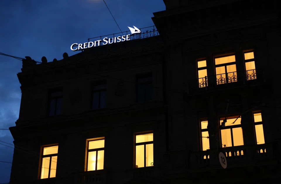 A logo of Credit Suisse is seen on the Credit Suisse headquarter as people demonstrate against the buying of Swiss bank Credit Suisse by UBS in Zurich, Switzerland March 20, 2023. REUTERS/Denis Balibouse