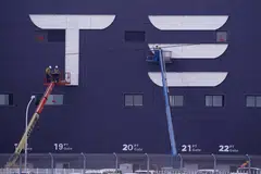 The workers say they welcome the award after Tesla has cut bonuses for many staff in the previous quarter.