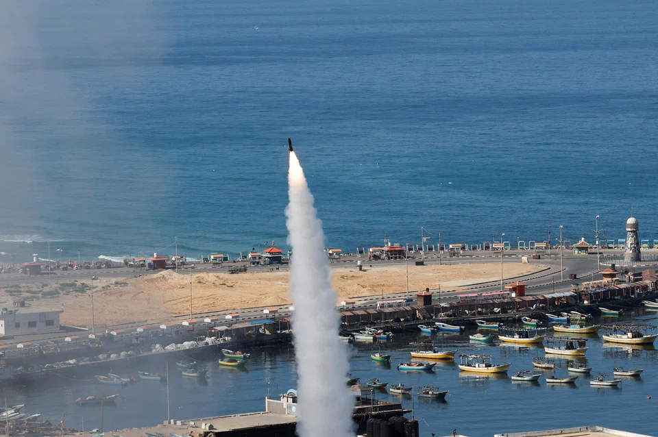 A rocket is fired by Palestinian militants into Israel, in Gaza City, Oct 7, 2023. 