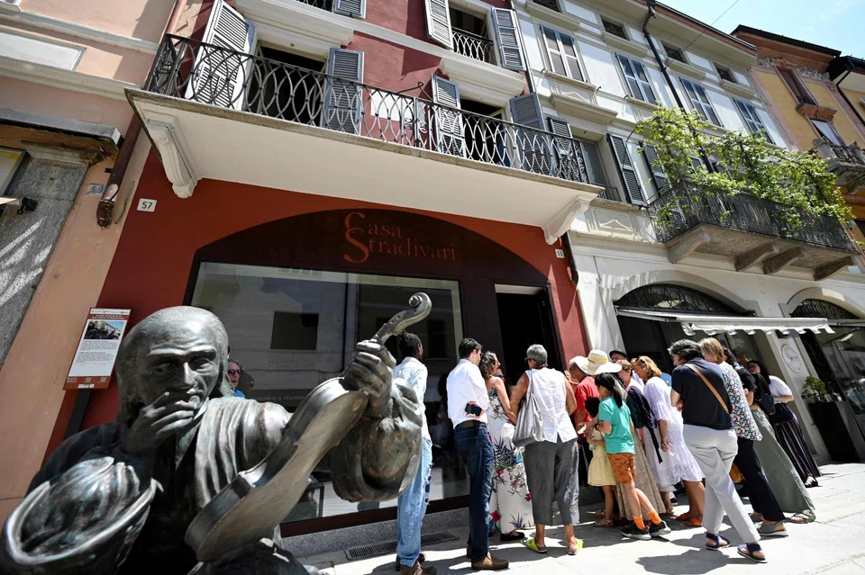 Visitors queue outside the Casa Stradivari in Cremona, after the opening of the house where the most famous of violin makers, Antonio Stradivari, lived and had his workshop in 1667. 