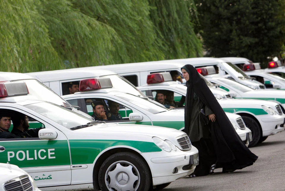 An Iranian policewoman preparing to start a crackdown to enforce Islamic dress code in this file photo taken on July 23, 2007; “Morality police have nothing to do with the judiciary, and have been abolished”, attorney-general Mohammad Jafar Montazeri has been quoted as saying by the ISNA news agency.