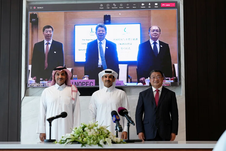 QatarEnergy CEO and Qatar's Minister of Energy Saad al-Kaabi (centre) attends a signing ceremony with Sinopec, in Doha, Qatar. The state energy company will send four million tonnes of liquefied natural gas annually to Sinopec