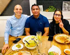 Azahari Harrison, a team manager at a global automobile company, is flanked by his mentors Rishi Hindocha (left) and Piya Sawhney from law firm Allen & Overy.