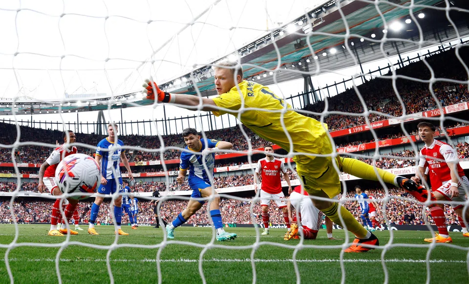 Brighton & Hove Albion's Julio Enciso scores their first goal against Arsenal at the Emirates Stadium, London, May 14, 2023.     