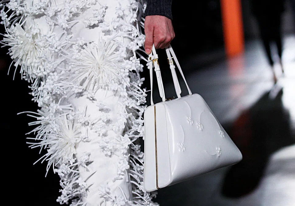 A model seen here with skirts embellished with white flowers.