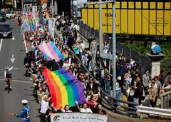 Participants at the Tokyo Rainbow Pride parade (top). The debate whether Japan’s laws against same-sex marriage are unconstitutional has split lower courts, with one district court holding the bar to be constitutional but others saying it is unconstitutional in varying degrees.