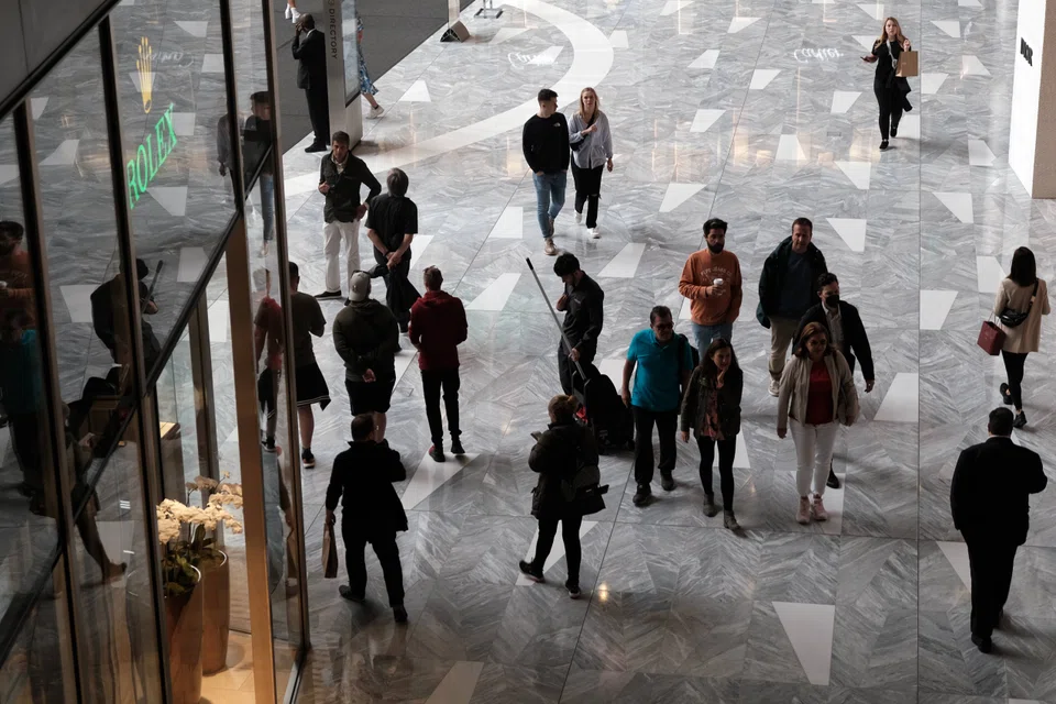 People shop in the Hudson Yards Mall in New York City. U.S. US President Joe Biden's team is still looking at options on whether to cut tariffs on Chinese imports to ease inflation, even as industry requests to maintain the duties mounted.
