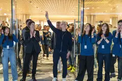Tim Cook, CEO of Apple (centre) opens an expansive new store in central Shanghai, signaling his company's commitment to China as a market and production base. 