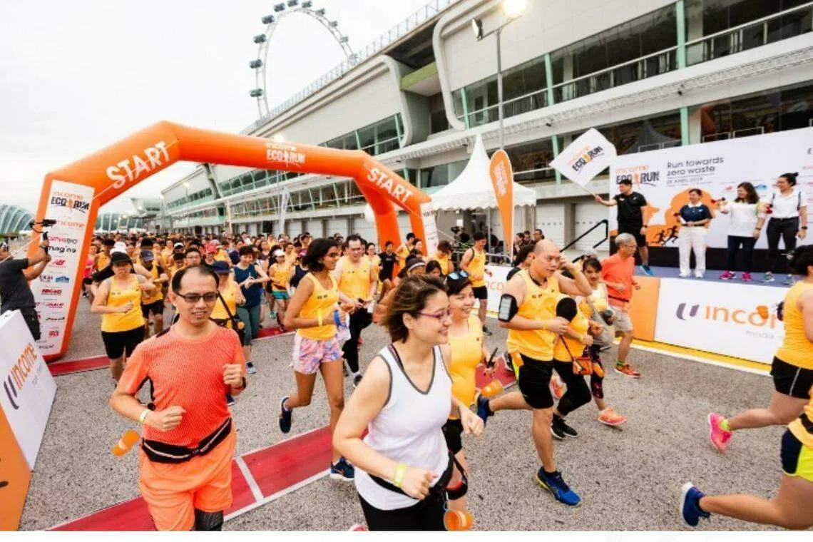 Runners taking off for the 5km Zero Waste Run in 2019. This year, participants are encouraged to wear their own orange T-shirts or past Income Eco Run race T-shirts so as to promote reusing and recycling of existing clothes.