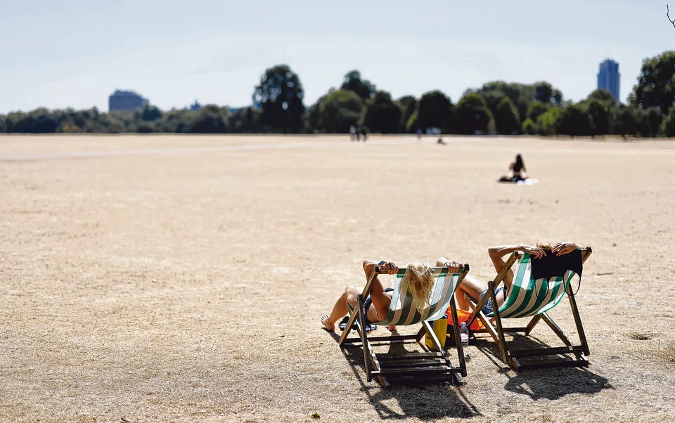 People sit in deckchairs in Hyde Park, central London, August 12, 2022. The Met Office said last month that the period from January to June this year saw the least rainfall in England and Wales since 1976.