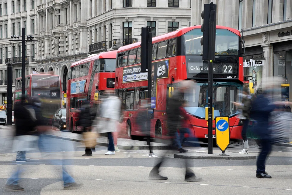 Shoppers in Oxford Circus in the heart of London's retail shopping area. The typical UK household will take a permanent 3.7 per cent hit to its income with the increase in personal taxes, says the Resolution Foundation.