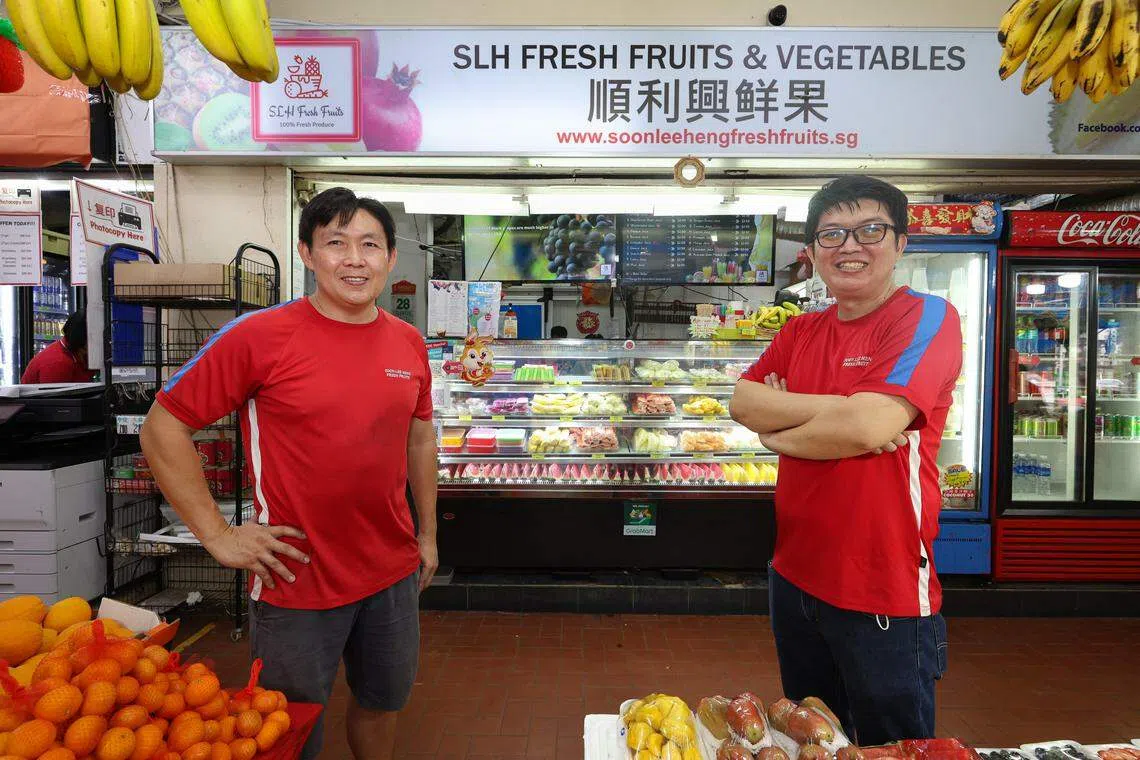 Brothers Ang Eng Guan (left) and Ang Eng Hwa set up fruits stall Soon Lee Heng (SLH) Fresh Fruits Trading in 2014.  
