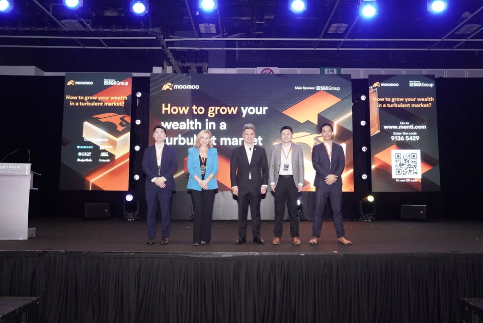Staying invested is the best way to reach one's investment objectives, said Evonne Tan (second from left), head of private banking at Barclays Singapore, at moomoo's seminar on Jul 16.