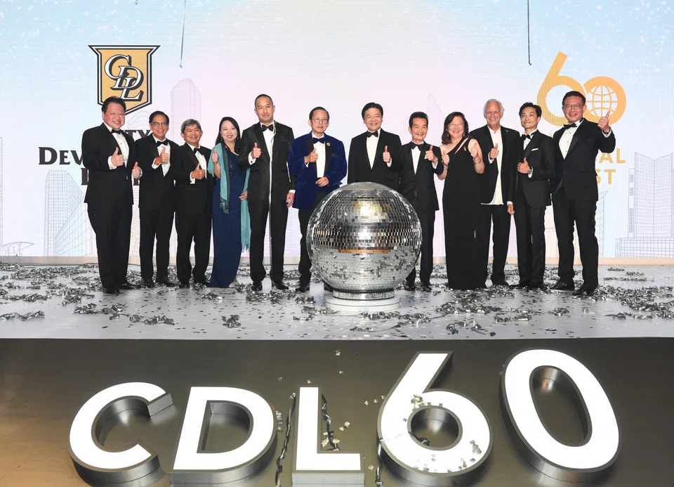 Present on stage are guest-of-honour Deputy Prime Minister and Minister for Finance Lawrence Wong (7th from left), CDL executive chairman Kwek Leng Beng (6th from left), CDL group CEO Sherman Kwek (5th from left), together with CDL's board of directors and senior management.