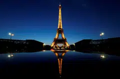 The Eiffel Tower is currently illuminated until 1.00 am by a lighting system that lends it a golden glow. 