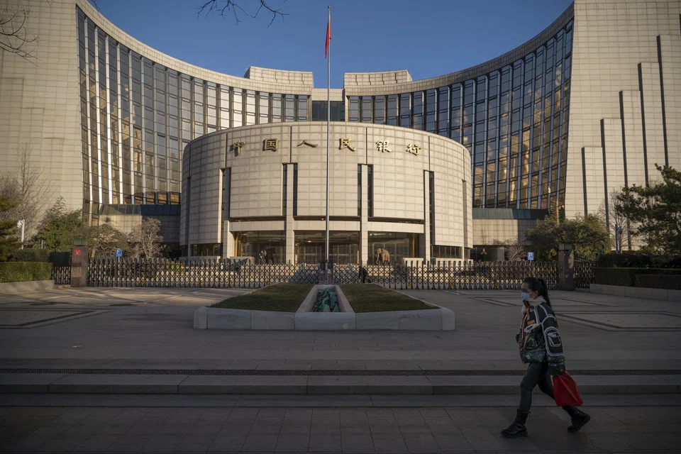 Chinese banks cut a key interest rate for long-term loans by a record amount, a move that would reduce mortgage costs and may boost weak loan demand amid a property slump and Covid lockdowns. 