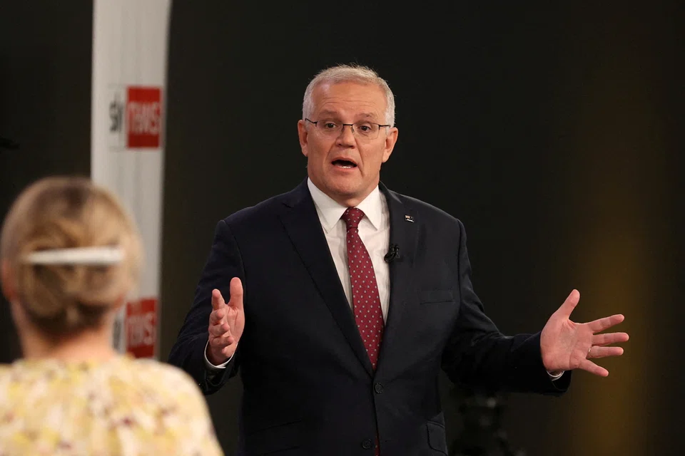 FILE PHOTO: FILE PHOTO: Australian incumbent Prime Minister Scott Morrison speaks during the first leaders' debate of the 2022 federal election, at the Gabba sports stadium, in Brisbane, April 20, 2022. AAP/ Jason Edwards via REUTERS    ATTENTION EDITORS - THIS IMAGE WAS PROVIDED BY A THIRD PARTY. NO RESALES. NO ARCHIVE. AUSTRALIA OUT. NEW ZEALAND OUT. NO COMMERCIAL OR EDITORIAL SALES IN NEW ZEALAND. NO COMMERCIAL OR EDITORIAL SALES IN AUSTRALIA./File Photo/File Photo