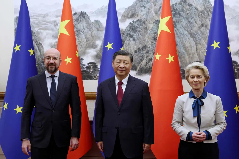 China's President Xi Jinping (C) receiving European Commission President Ursula von der Leyen (R) and European Council President Charles Michel ahead of the 24th EU–China Summit in Beijing.