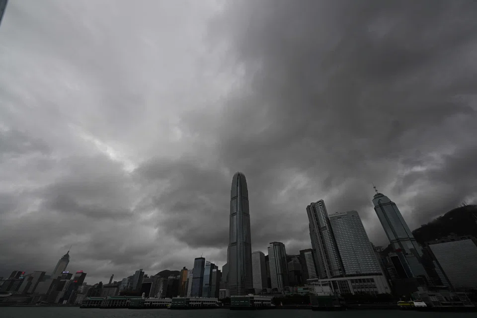Heavy rain clouds are seen over Central district as Hong Kong hoisted typhoon signal no. 8 around noon on Oct 8, 2023.