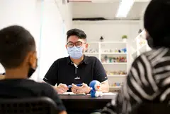 A social worker from AWWA Family Service Centre in a family session.