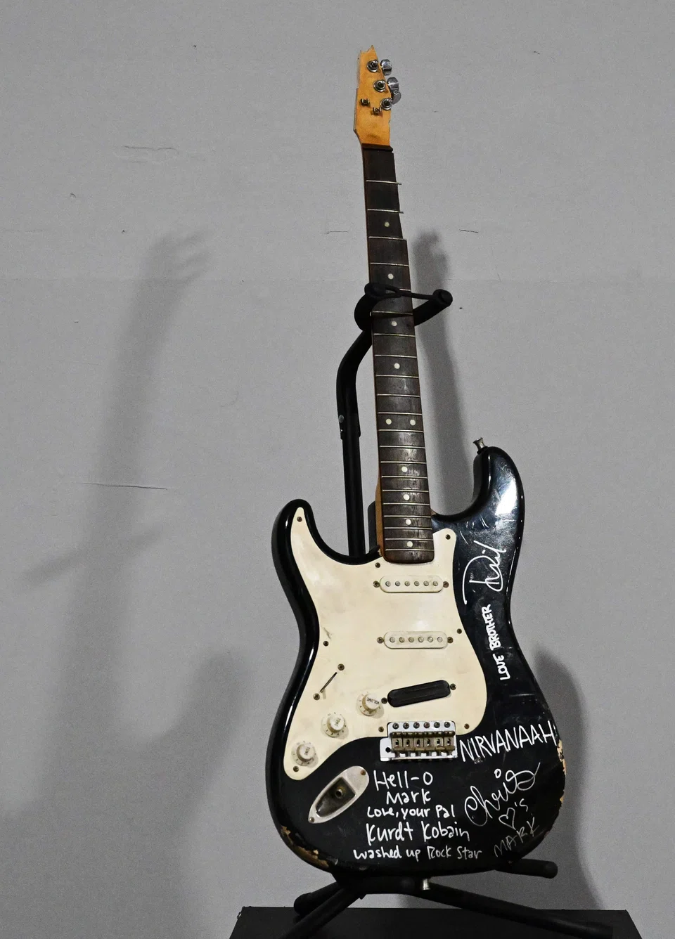 The busted black Fender Stratocaster has been put back together, but is no longer playable, Kody Frederick of Julien’s Auctions says.