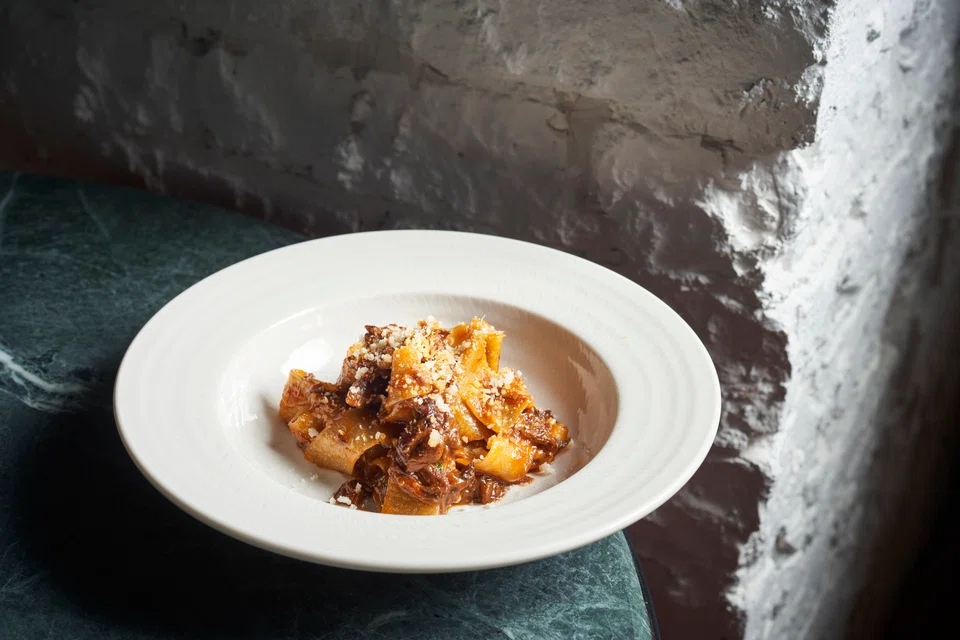 Pappardelle e Coda alla Vaccinara features wide noodles in oxtail ragu
