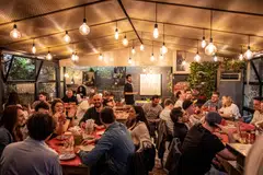Diners at the new Pizzeria L'Elementare, which serves up thin-crust pizzas and craft beers, in Rome on May 5. 
