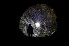 An employee guides inside a tungsten mine in Gangwon Province, South Korea, March 31, 2022. 