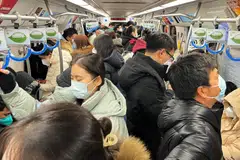 Subway trains in Beijing and Shanghai are packed as residents commute to work.