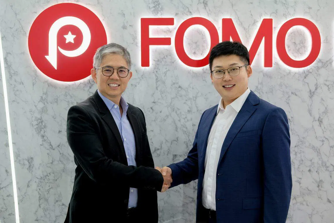 CapBridge Financial chief executive Johnson Chen (left) and Fomo Group chairman Louis Liu. Along with the acquisition, Fomo Group has also secured a Capital Markets Services licence and a Recognised Market Operator licence in Singapore.