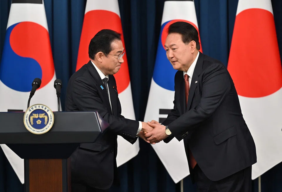 South Korean President Yoon Suk Yeol (right) with Japanese Prime Minister Fumio Kishida, who was in Seoul for the first visit to the South Korean capital by a Japanese leader in 12 years.