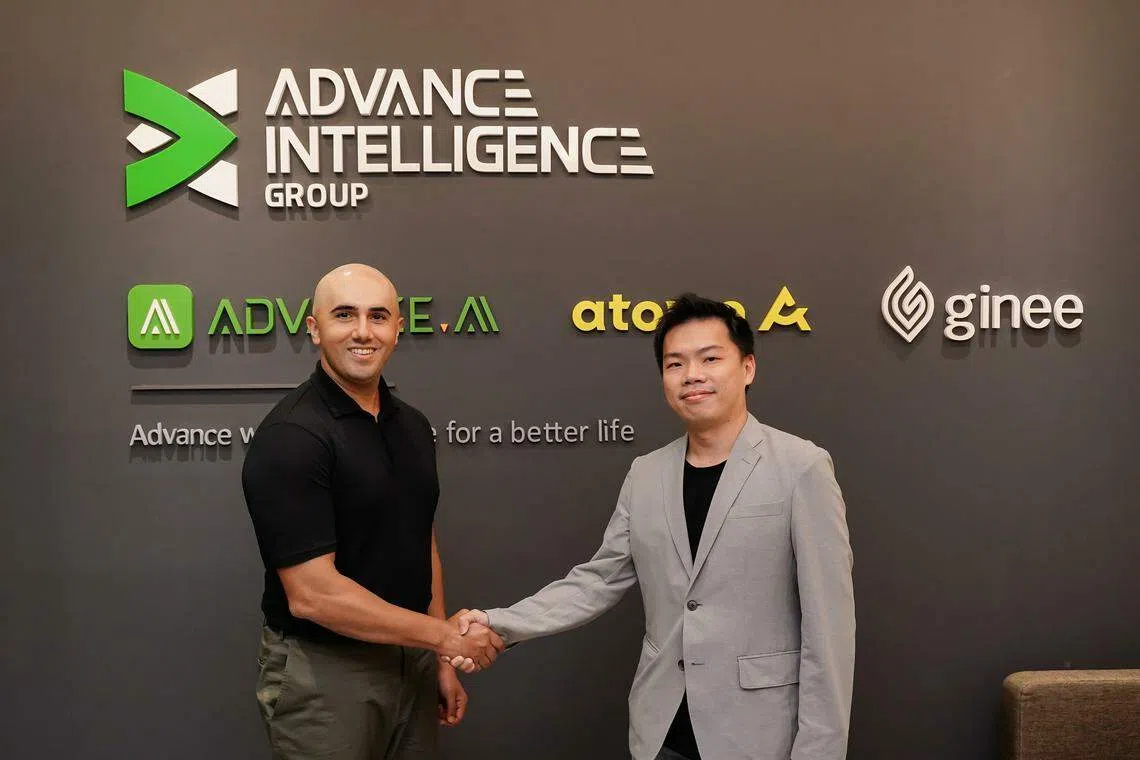 Umair Javed, senior vice-president for M&A and corporate development at Advance Intelligence Group, with Sean Lam, CEO of Jewel Paymentech.