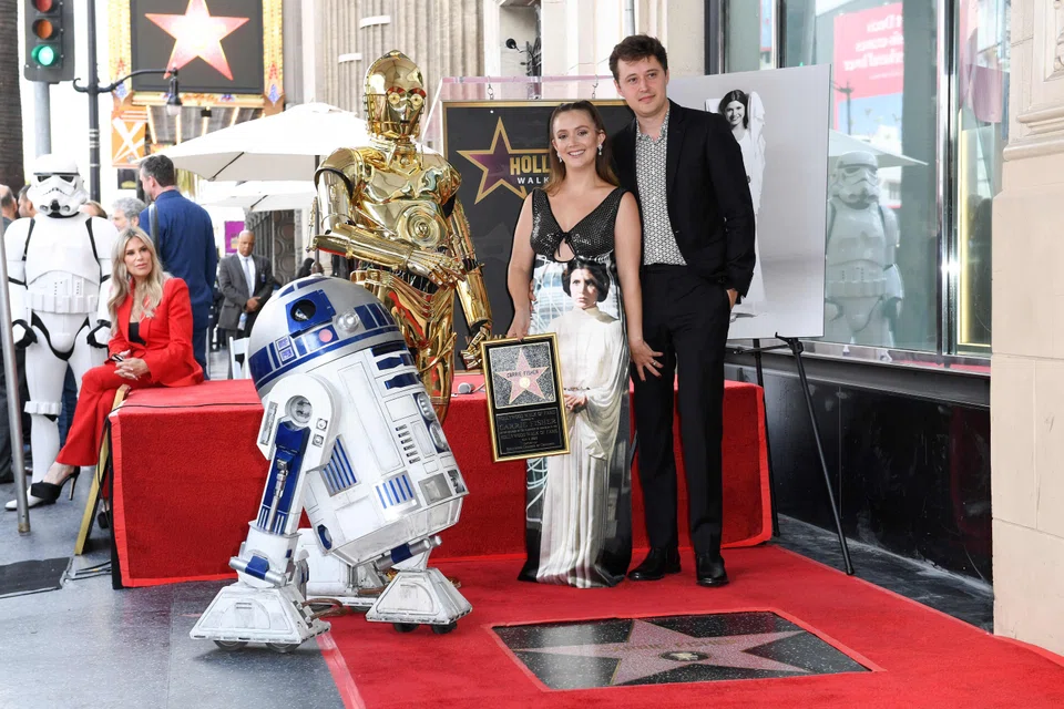 Actress Billie Lourd (left) and her husband Austen Rydell at a ceremony honouring her mother, Carrie Fisher who was posthumously awarded a star on the Hollywood Walk of Fame, Hollywood, California, May 4, 2023. 
