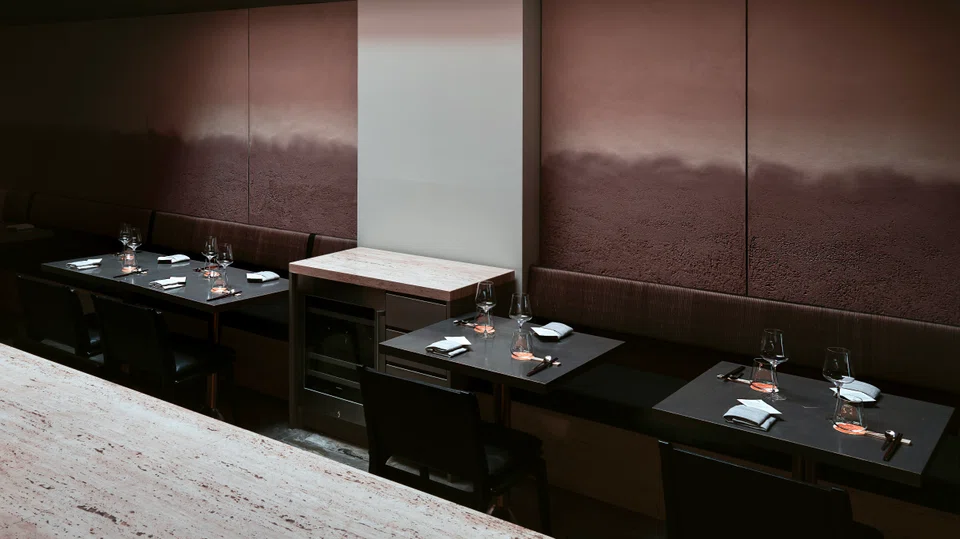 Nouri's revamped interiors feature crushed clay walls and Thai silk seat cushions.