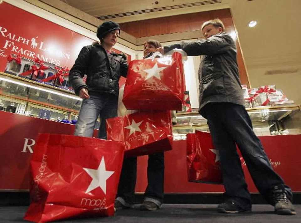  Shoppers at Macy's in New York. Its CEO Jeff Gennette says roughly half of Macy’s brand customers make less than US$75,000 per year, which is why the decline in sales at those stores was the most prominent.   