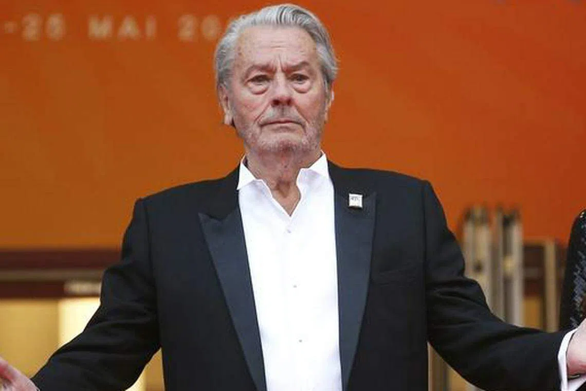 Officers also found more than 3,000 rounds of ammunition and a shooting range in Alain Delon's (top) rural home in Douchy-Montcorbon, some 135 km south of Paris. 