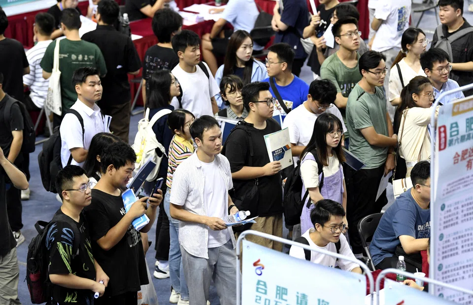 University graduates attend a job fair in Hefei, Anhui province, China, Sept 4, 2023. On Wednesday, China's statistics bureau is expected to omit for the fourth consecutive month the release of youth unemployment data, suspended in July after reaching a record 21.3 per cent in June, just as 11.6 million fresh graduates were entering the job market.